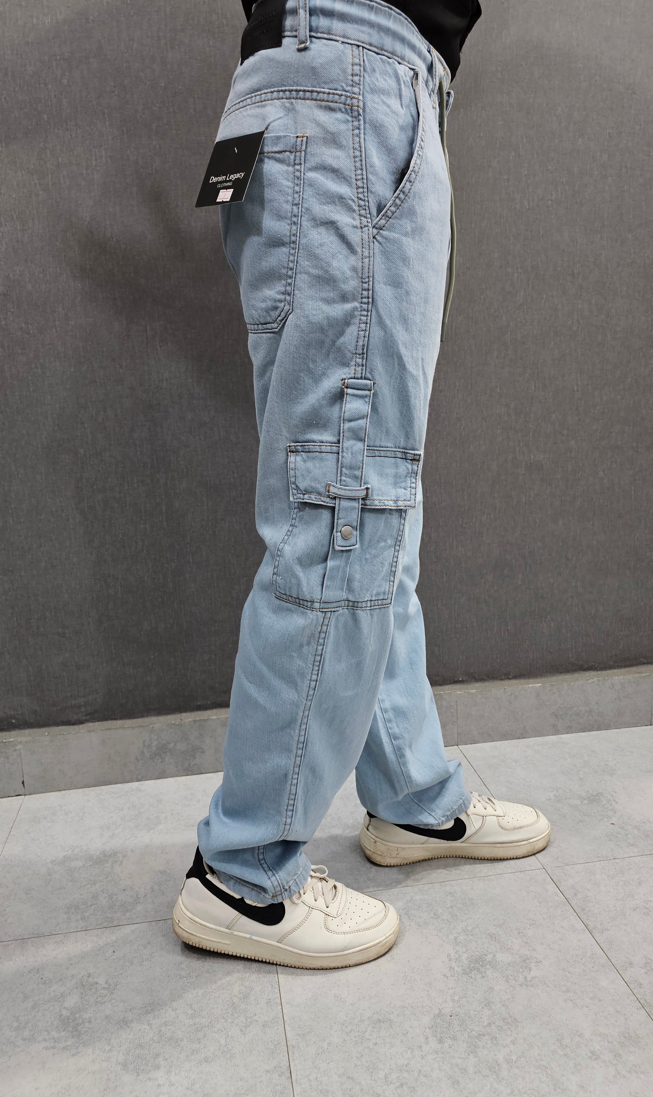 Loose Fit 6 pocket Jeans closed with snap button loop, Soft comfortable non-stretch Denim, elasticated belt. Ice Blue.