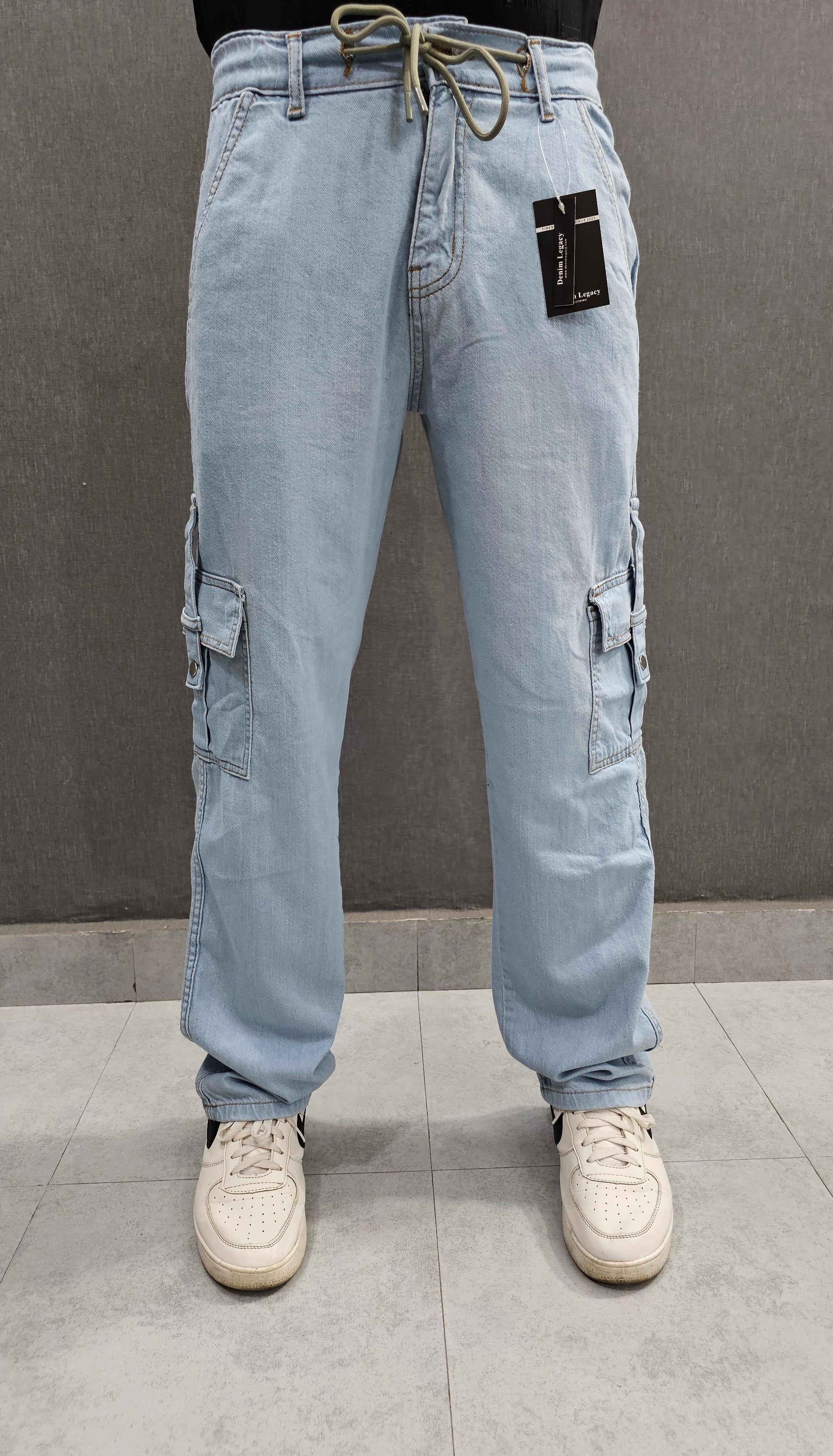 Loose Fit 6 pocket Jeans closed with snap button loop, Soft comfortable non-stretch Denim, elasticated belt. Ice Blue.